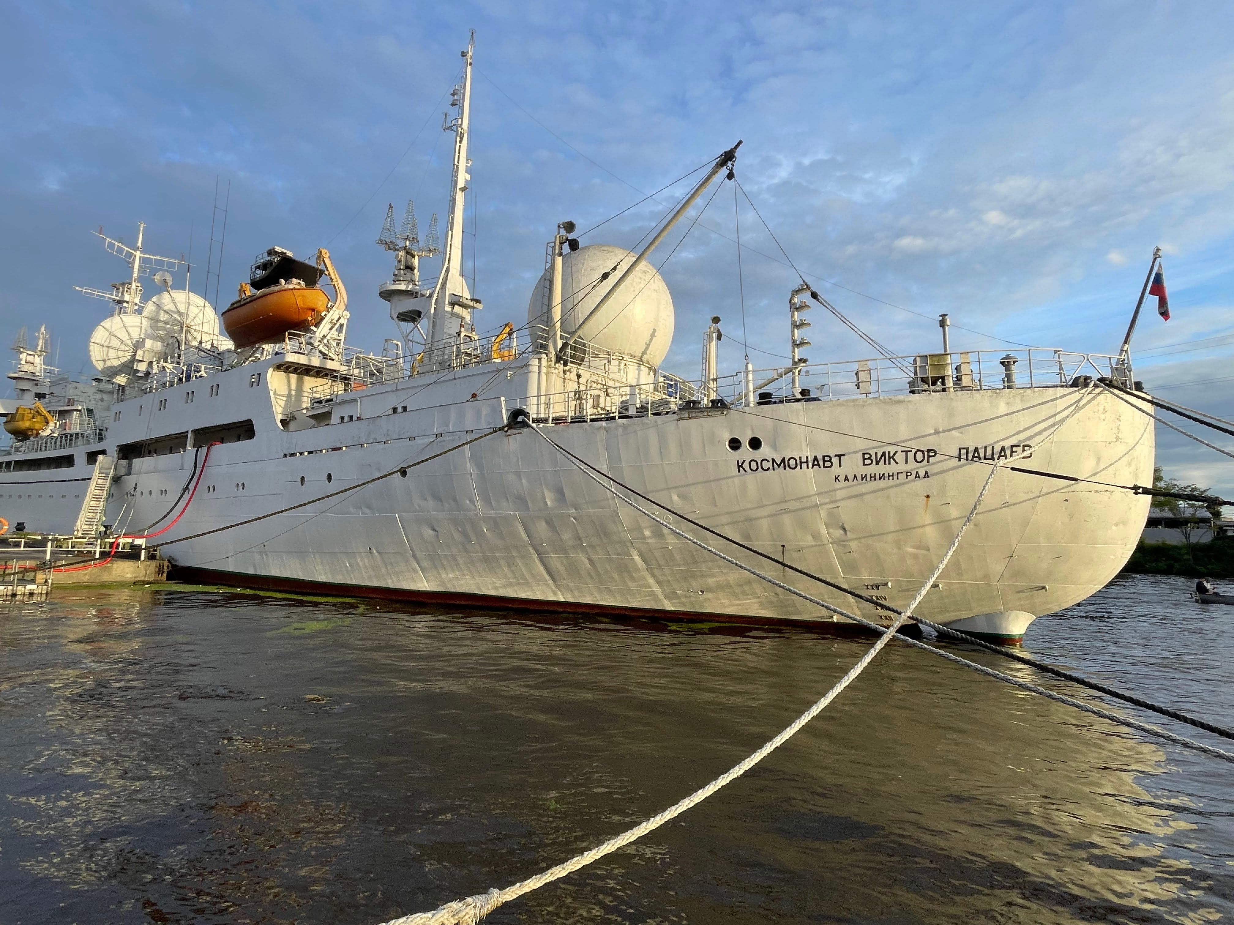 Docked Kosmonavt Viktor Patsaev ship in sunny Kaliningrad harbor.