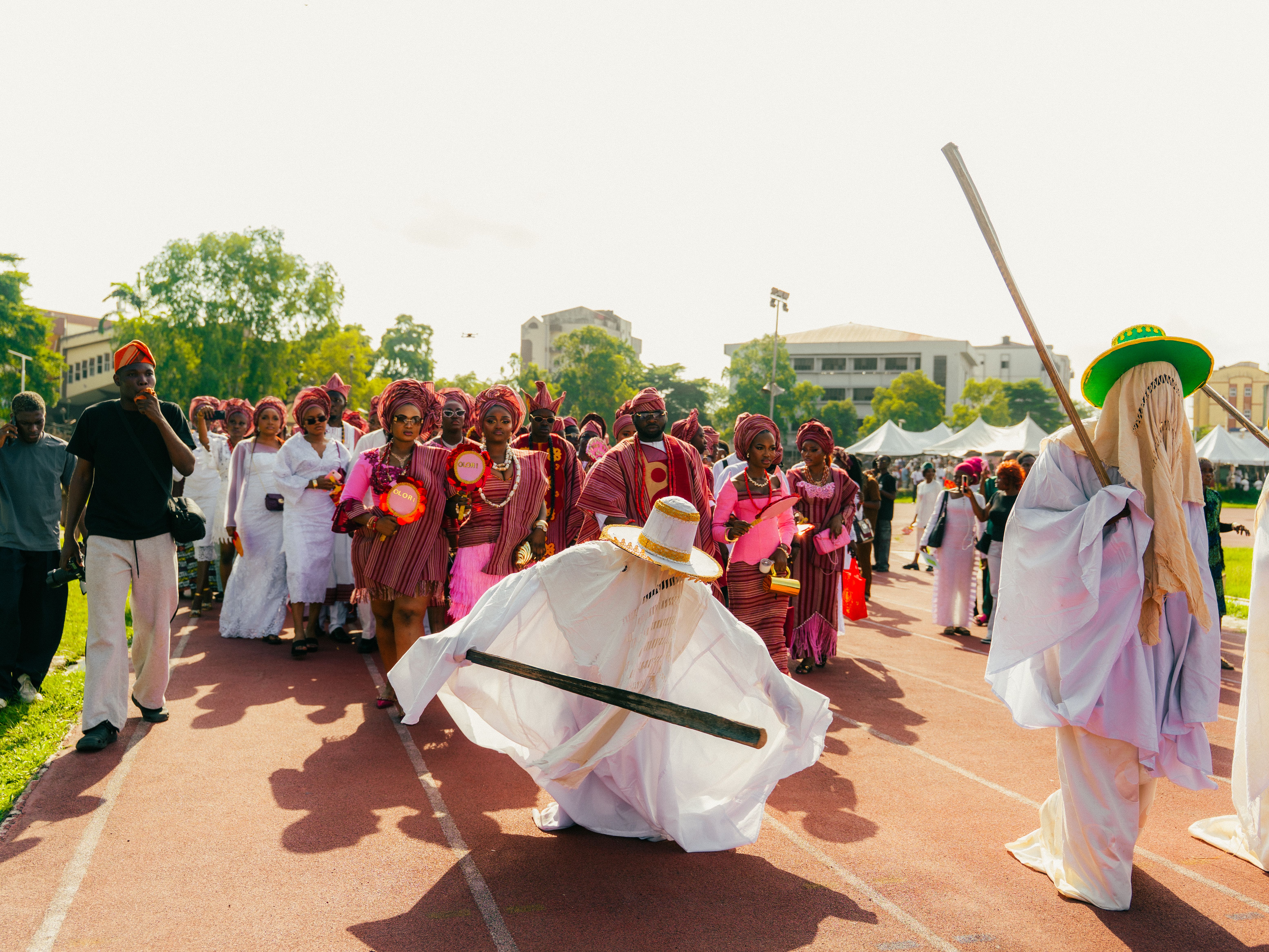 Vibrant parade showcasing traditional Nigerian attire and cultural celebration outdoors.