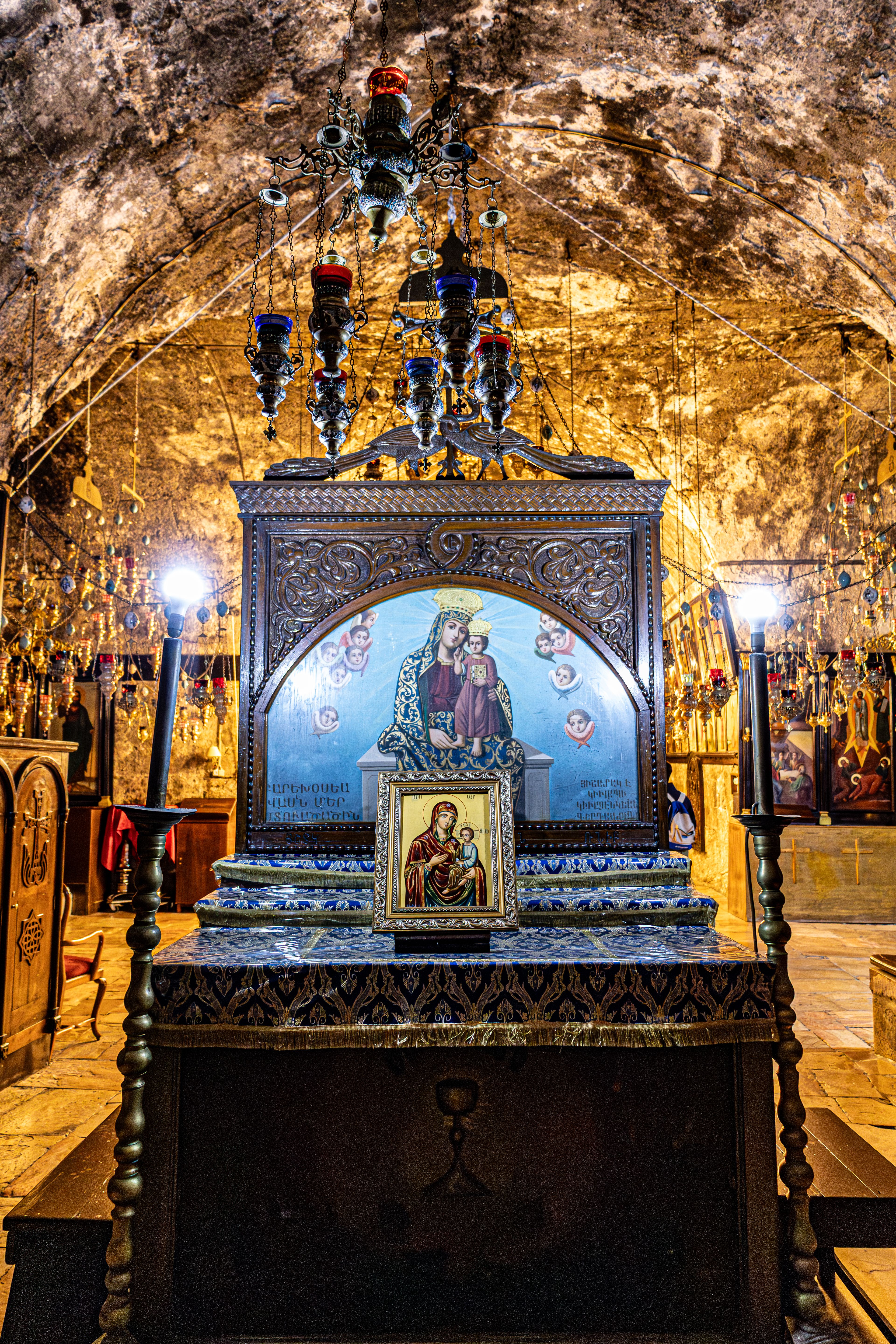 Intricately designed religious icon inside a historic Jerusalem church, showcasing spiritual art.