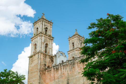 Explore the historic charm of Valladolid Cathedral against a bright blue sky, a stunning example of Yucatán architecture.