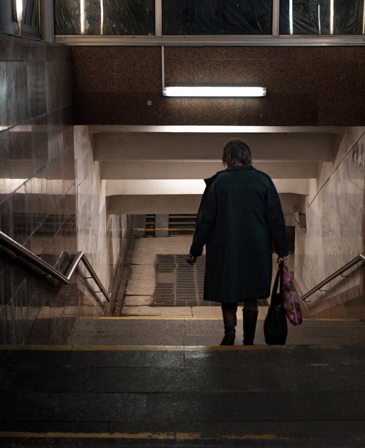 Woman Going Down The Stairs