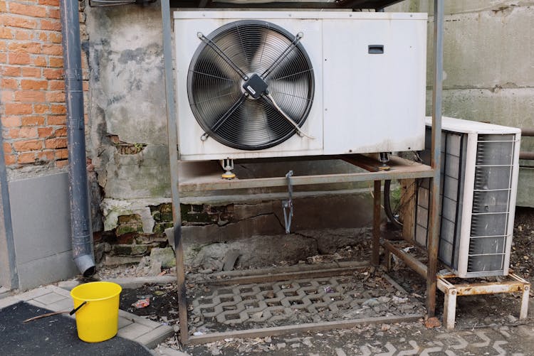 Air Conditioner Unit Near Wall Of Modern Building On Street