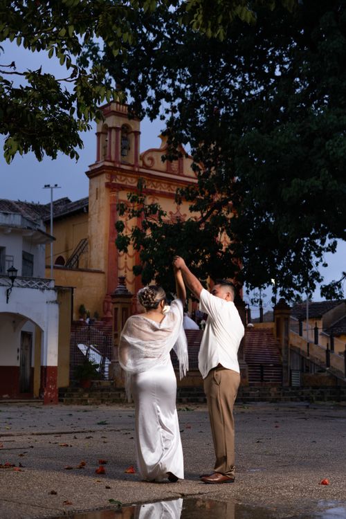 Free A couple shares a romantic dance in the historic square of Comitán de Domínguez, Mexico. Stock Photo