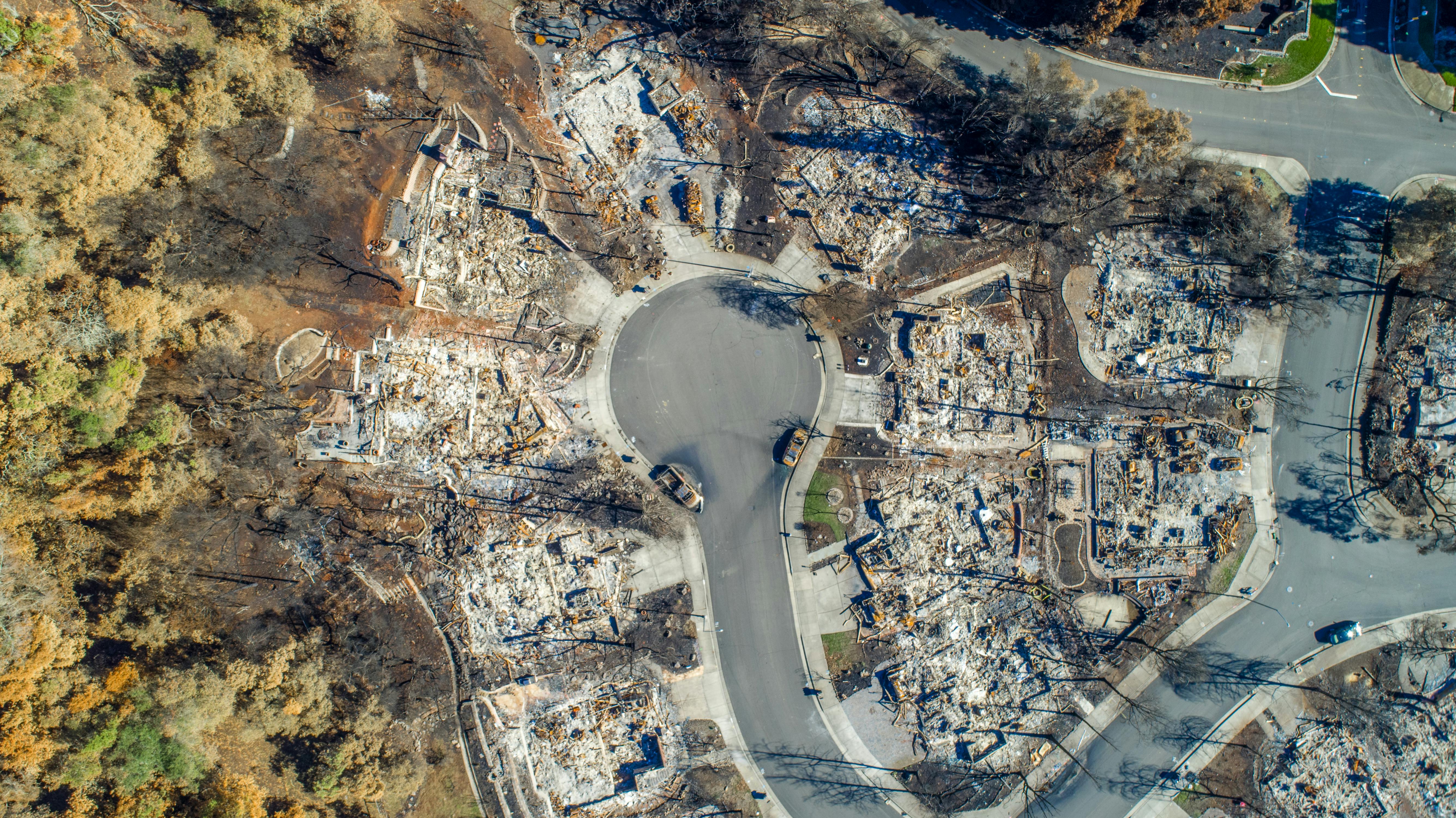 drone shot of a destroyed neighborhood