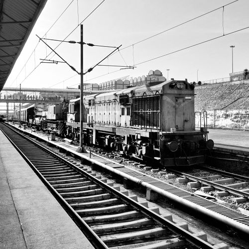 Free Monochrome image of a train at a railway station, showcasing industrial design. Stock Photo