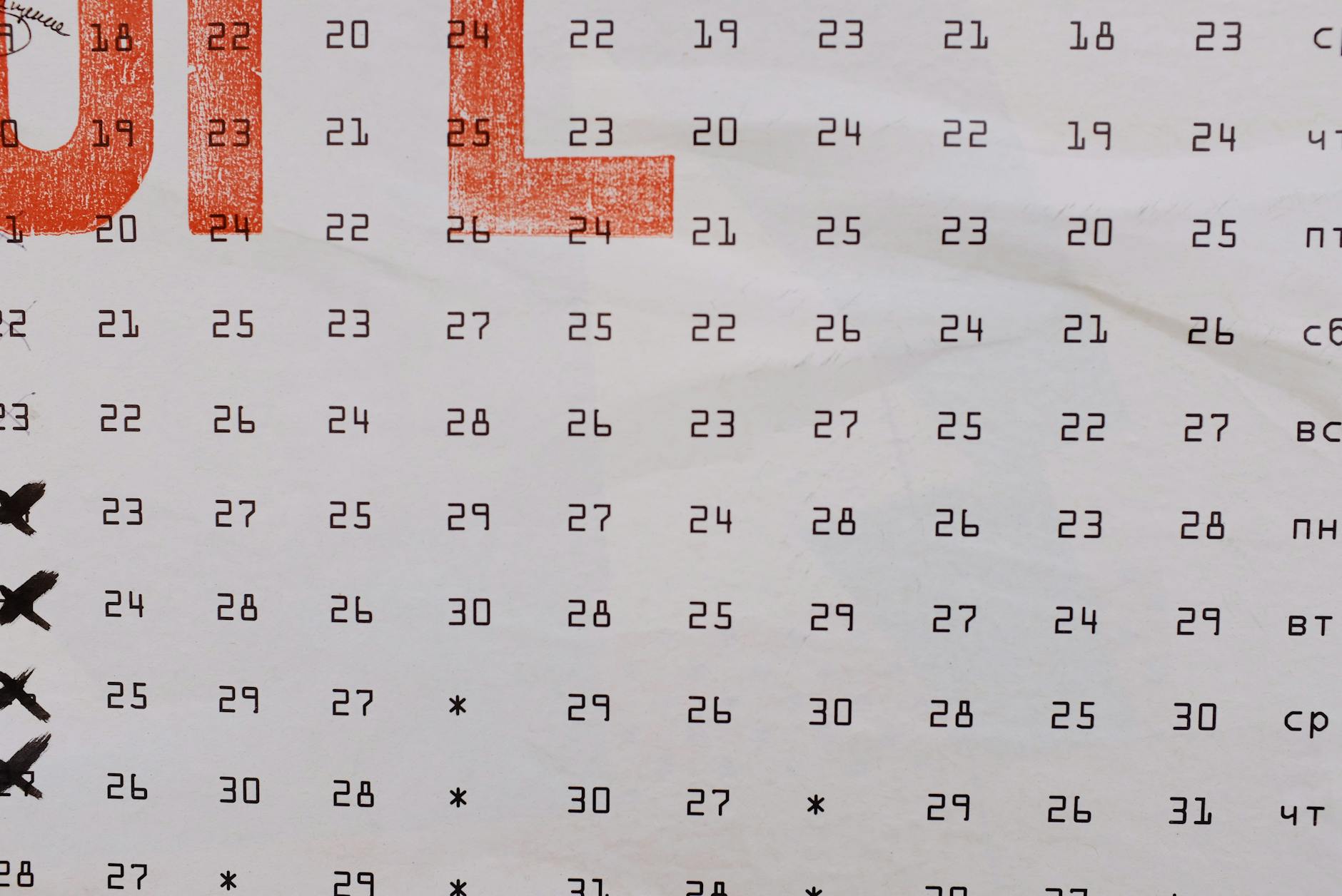 Abstract calendar banner with numbers printed in rows and days of week aside placed on wall on street