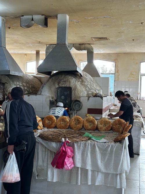 Free A busy traditional bakery in Tashkent, Uzbekistan with fresh bread and bakers at work. Stock Photo