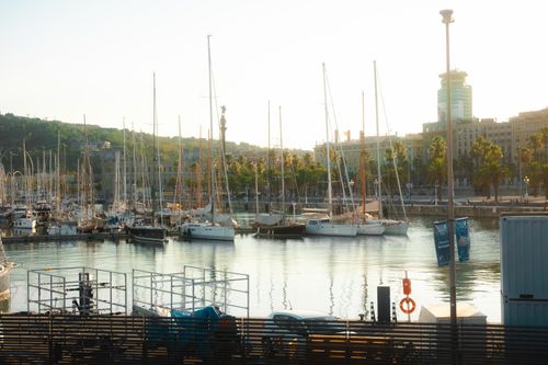 Free Beautiful view of Barcelona marina with yachts and sailboats, capturing the summer sunlight. Stock Photo