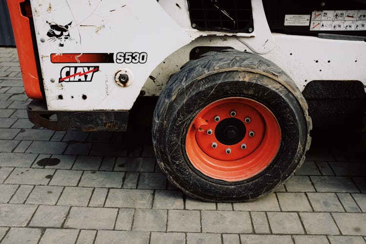 Wheels Of Small Truck Parked On Pavement On Street