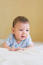 Baby in Blue Shirt Lying on White Textile
