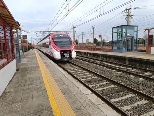 Free Modern train arriving at La Rinconada railway station in Andalucía, Spain. Stock Photo