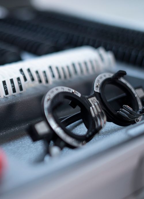 Free Detailed view of optometry trial lens set with trial frames for vision testing. Stock Photo