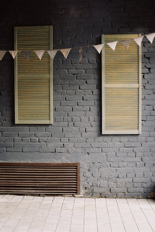 Brown Wooden Window on Gray Concrete Wall