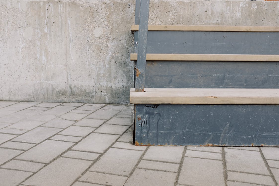 Wooden Stairs Beside Gray Concrete Wall · Free Stock Photo