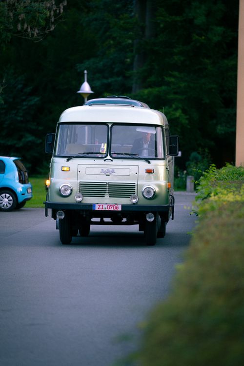 Free A classic vintage camper van driving on a forest road in Bertsdorf-Hörnitz, Germany. Stock Photo