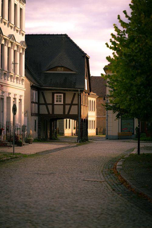 Free Charming street in Zittau, Germany showcasing traditional architecture at sunset. Stock Photo