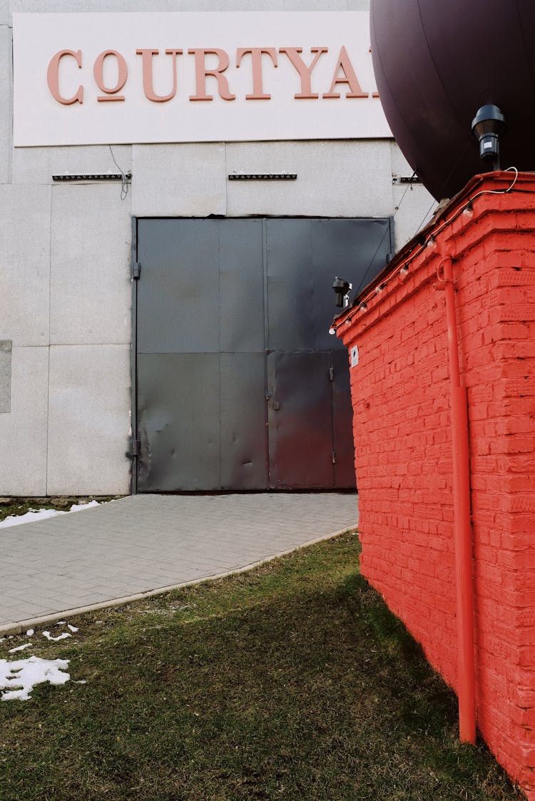 Red Brick Wall Near Courtyard Entrance Gate