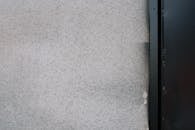 Concrete wall with part of door frame