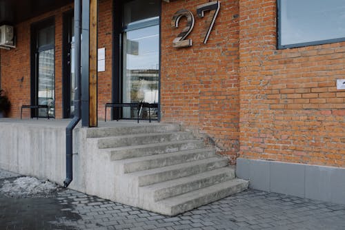 Brown Brick Building With Glass Window And Door