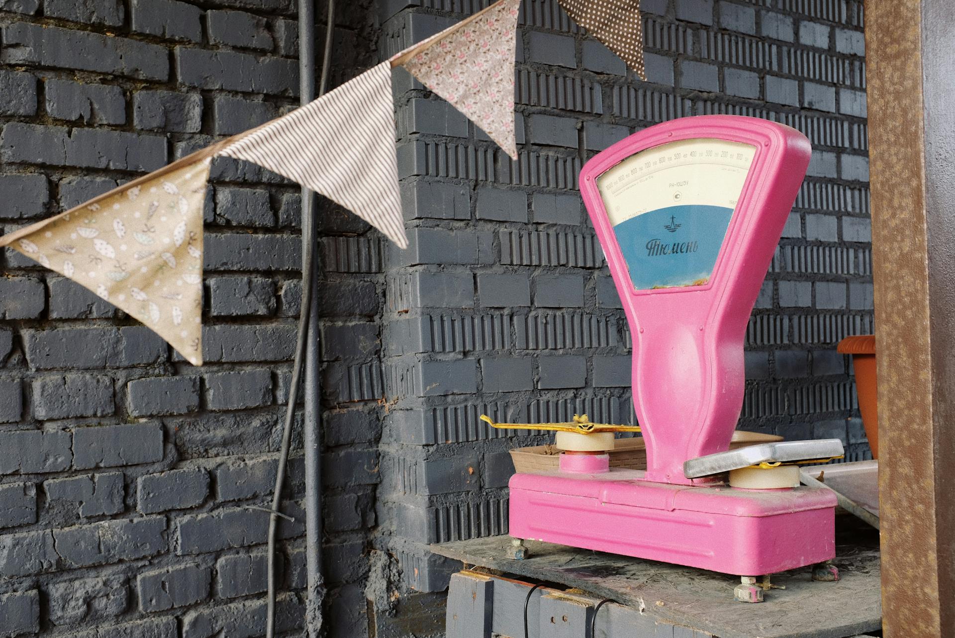 Pink and White Weighing Scale