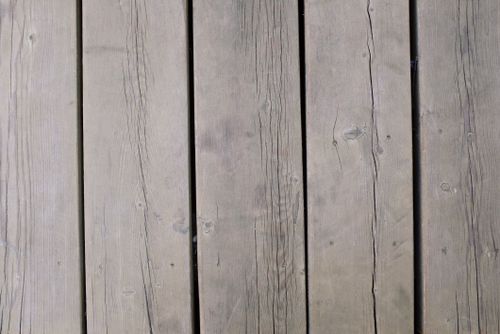 Free Detailed view of weathered wooden planks, showcasing texture and grain, ideal for backgrounds and design use. Stock Photo