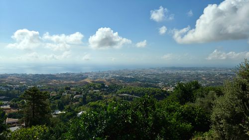 Free Scenic view of rolling hills and ocean from Mijas, Andalusia under a bright blue sky. Stock Photo