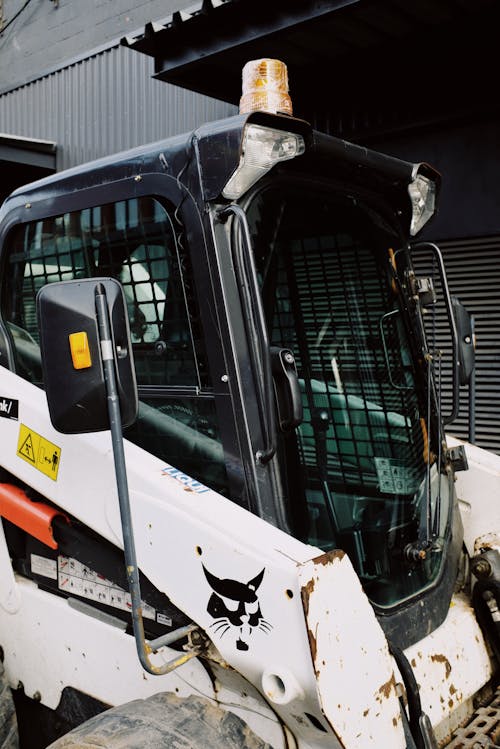 Mini loader parking on territory of enterprise