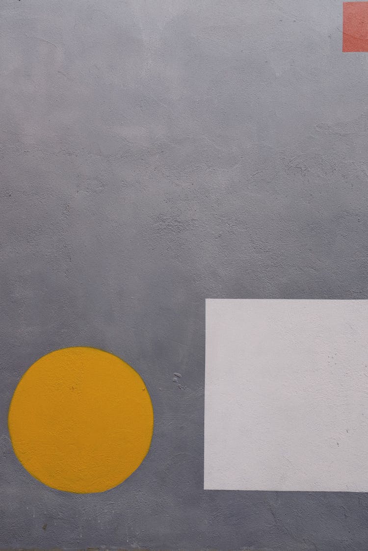 Yellow Circle And White Square On Gray Surface