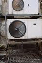 Compressors in white casings running on full power while installed outside of building