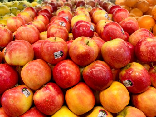 Free A vibrant array of fresh red apples stacked neatly in a market in Tarneit, Victoria. Stock Photo