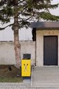 Entrance to property surrounded with concrete wall
