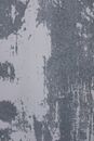 Blind shabby concrete wall with big traces of scratched stucco on surface