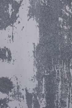 Blind shabby concrete wall with big traces of scratched stucco on surface