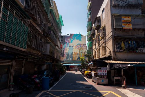 Free Vibrant street art mural in a bustling alley of New Taipei City, Taiwan, capturing urban culture. Stock Photo