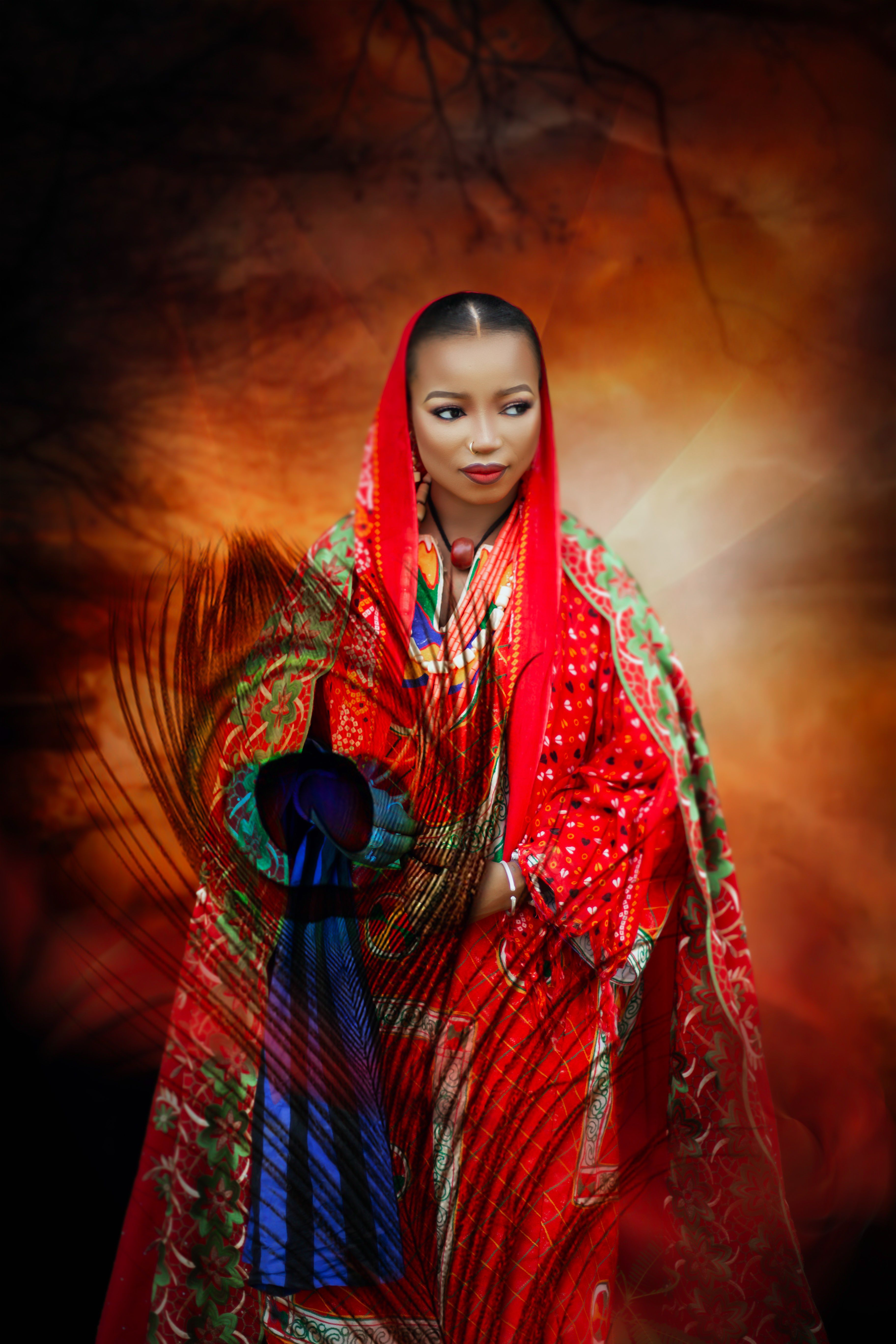 A beautiful Nigerian woman in vibrant traditional attire, exuding cultural elegance and grace.