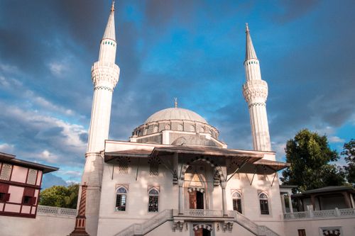 Free Stunning view of the Sehitlik Mosque in Berlin showcasing Islamic architecture against a cloudy sky. Stock Photo