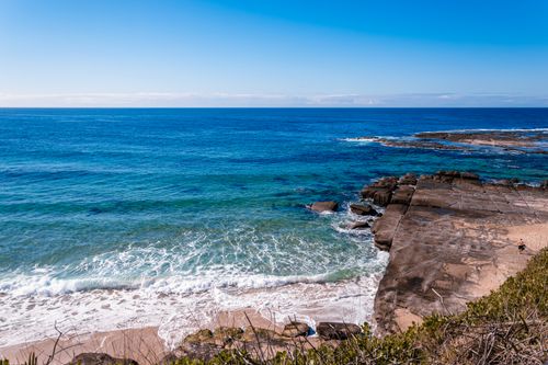 Free Breathtaking view of a blue ocean from a rocky coastline, perfect for travel inspiration. Stock Photo