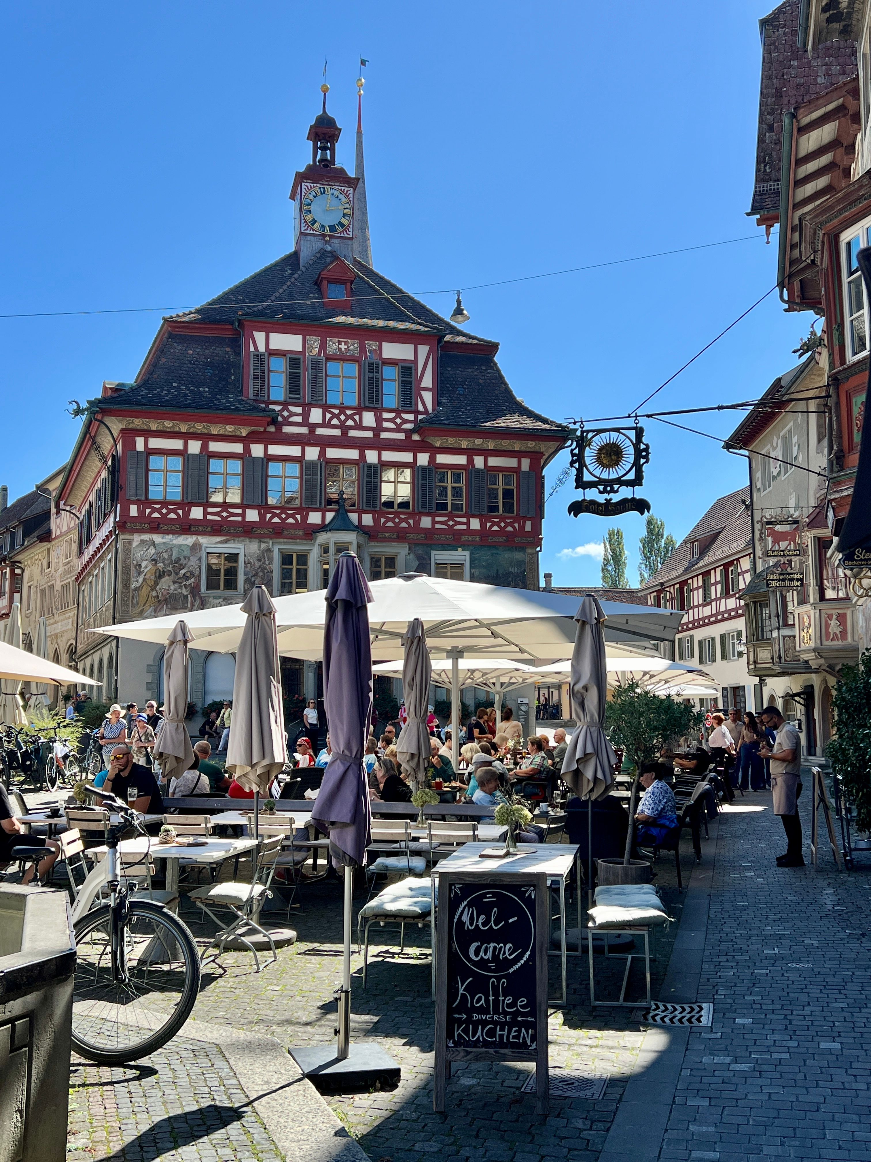 Historic timber-framed buildings and lively cafe scene in Stein am Rhein, Switzerland.