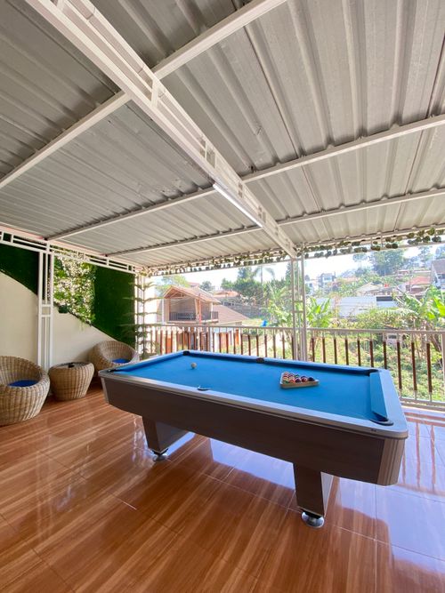 Free Charming outdoor patio in Central Java featuring a pool table with a beautiful view. Stock Photo