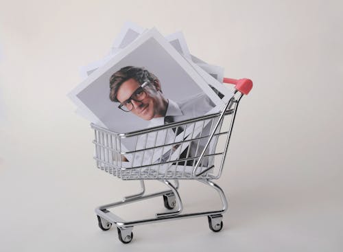 Photo of Man in Black Framed Eyeglasses in Shopping Cart