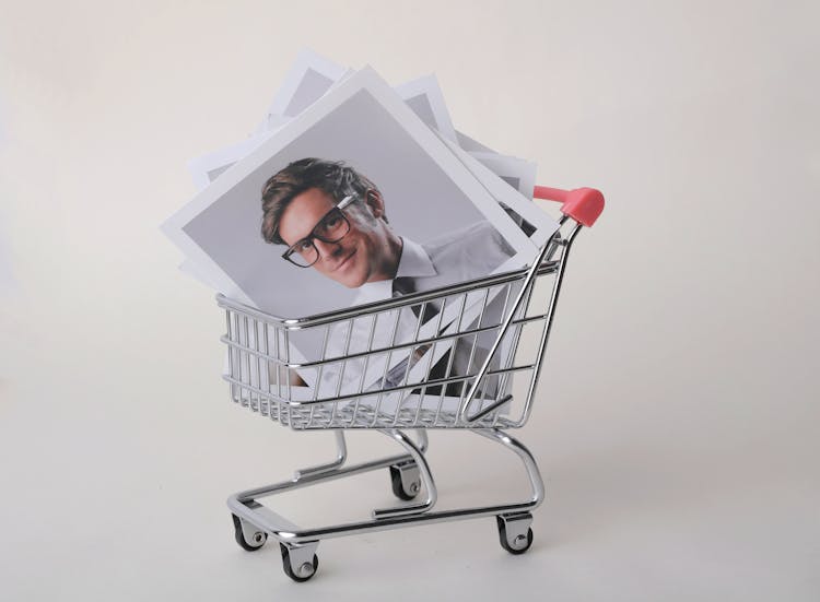 Photo Of Man In Black Framed Eyeglasses In Shopping Cart