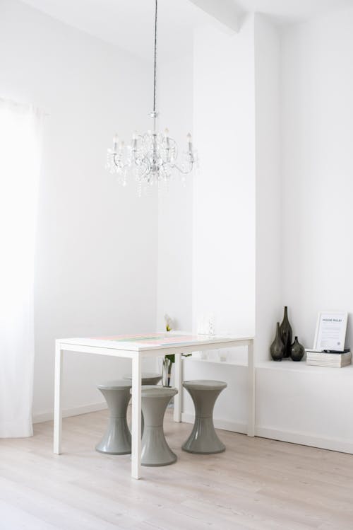 White Wooden Table With Gray Chairs