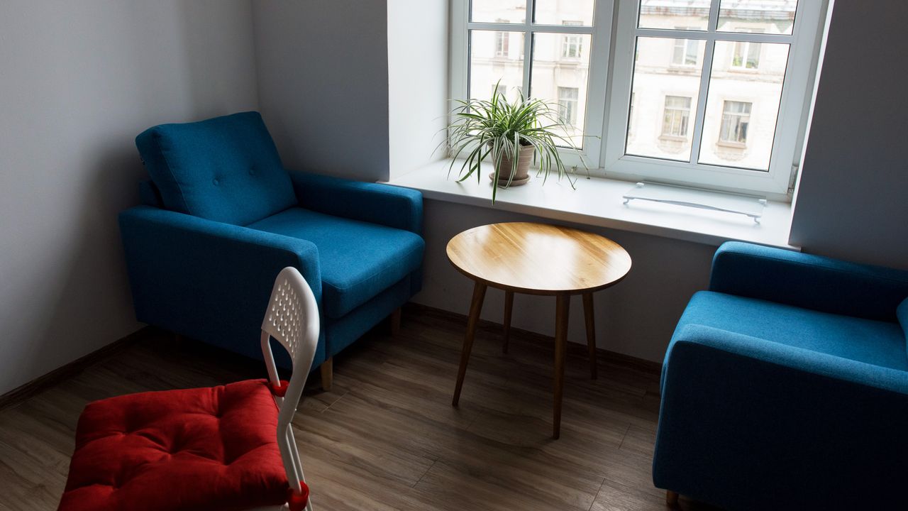 Shared living room in a co living apartment Comfortable shared apartment living room used by residents in a co living arrangement