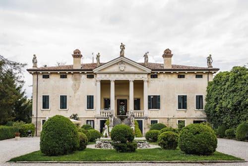 Free Mansion with Statues on the Roof Stock Photo