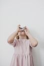 Adorable little girl drinking cup of milk