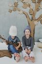 Kids Playing Cardboard Guitar Sitting on Floor