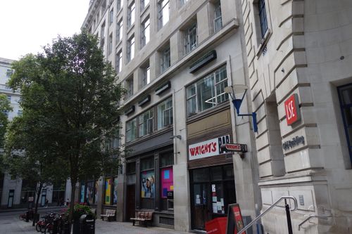 Free View of the LSE building and Wright's Bar in a quiet London street. Stock Photo