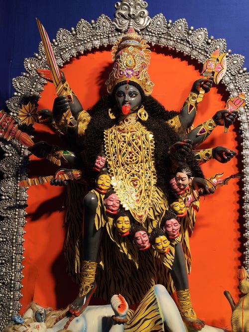 Free Vibrant and detailed sculpture of Goddess Kali with multiple arms and symbolic adornments. Stock Photo