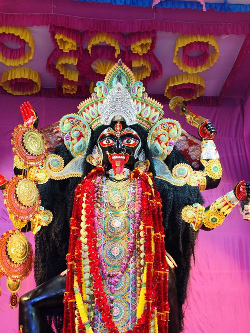 Free Vibrant depiction of Hindu Goddess Kali adorned with intricate decorations and jewels. Stock Photo