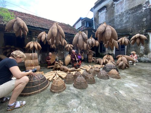 Free Artisans creating traditional fish traps in an outdoor courtyard setting. Stock Photo